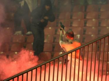 The police officer defends his life by firing live rounds into the air