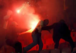 Red Star Belgrade hooligans try to set fire to undercover policeman in the stands
